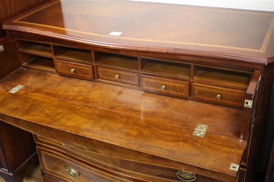 A mahogany serpentine inlaid chest of drawers W.110cm